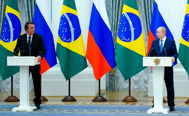 FILE PHOTO: Russian President Putin and his Brazilian counterpart Bolsonaro