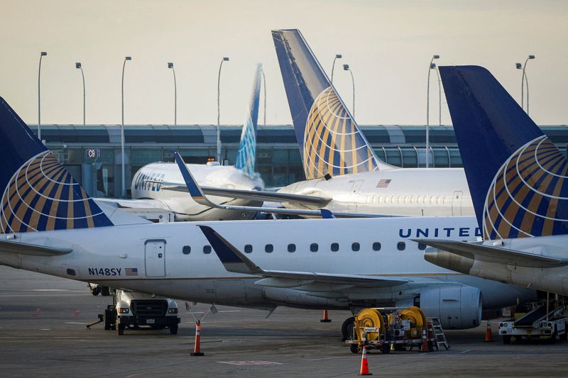 FILE PHOTO: United Airlines planes are parked at their gates