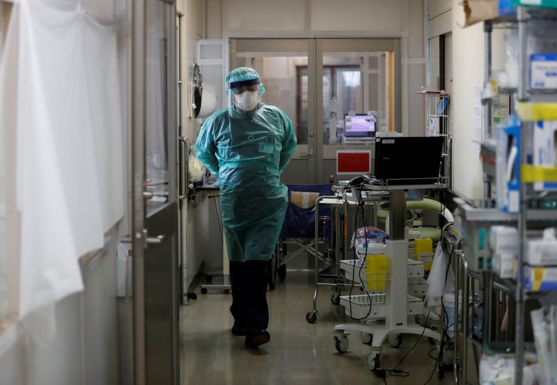 A medical worker walks inside ICU ward at St. Marianna