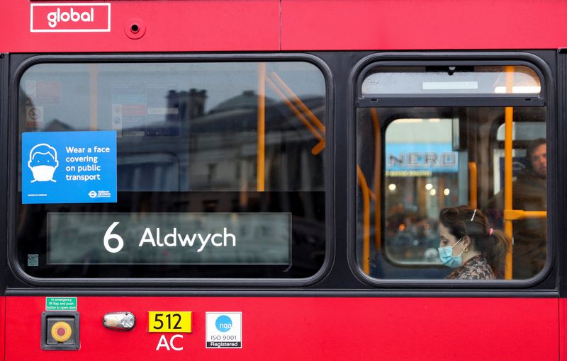 A COVID-19 notice is seen on a bus in London