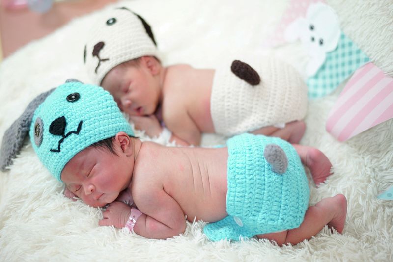 FILE PHOTO: Newborn babies wearing dog costumes to celebrate the