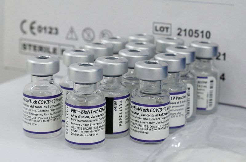FILE PHOTO: Vials containing the Pfizer/BioNtech vaccine against COVID-19 are