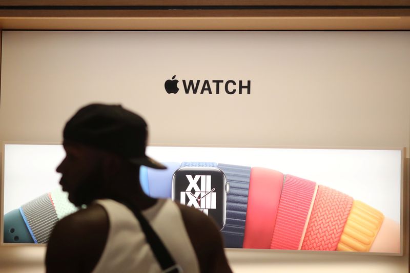 FILE PHOTO: A customer browses Apple watches at the new