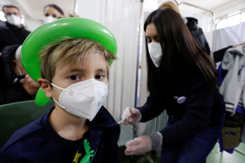 FILE PHOTO: Pupils receive COVID-19 vaccination in Naples