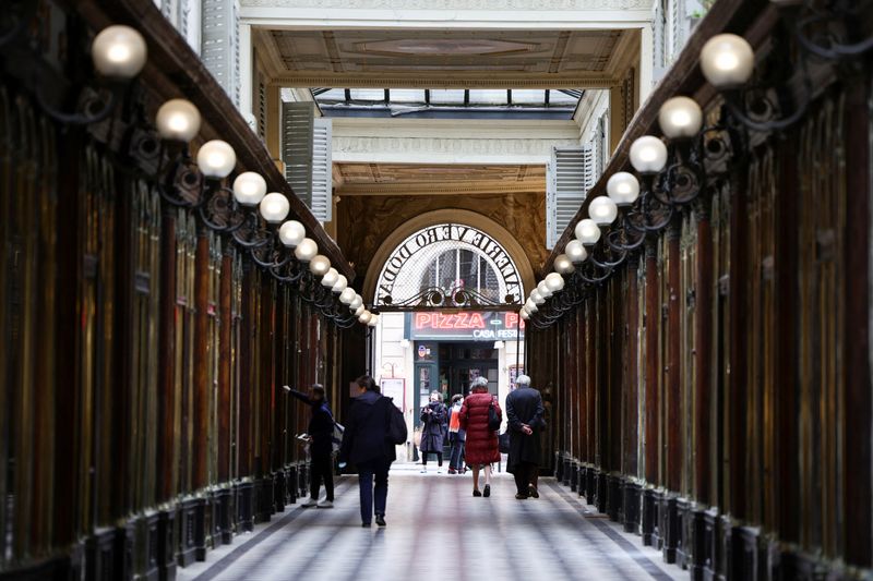 People walk in the Galerie Vero-Dodat covered arcade in Paris