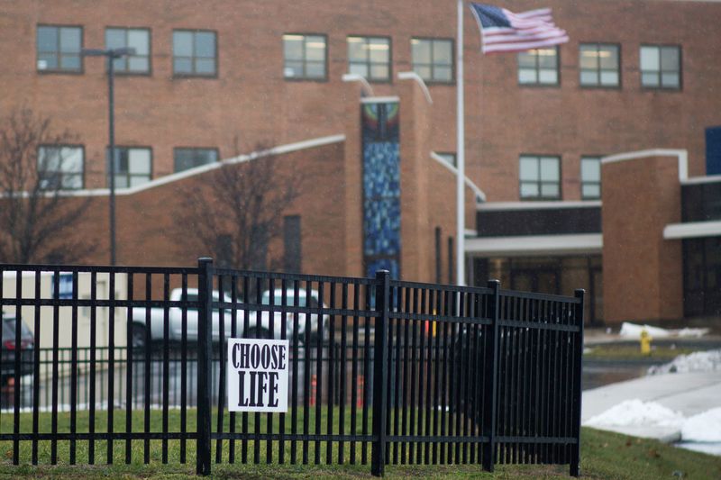 FILE PHOTO: An anti-abortion sign hangs on a fence in