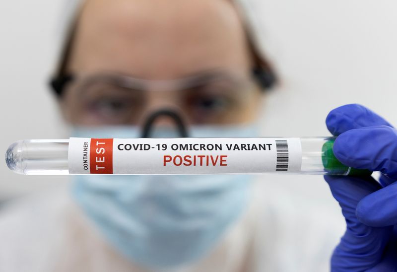 Illustration shows test tube labelled “COVID-19 Omicron variant test positive