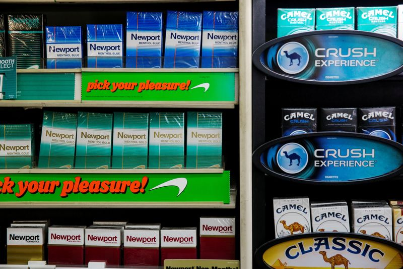 FILE PHOTO: Newport and Camel cigarettes are stacked on a