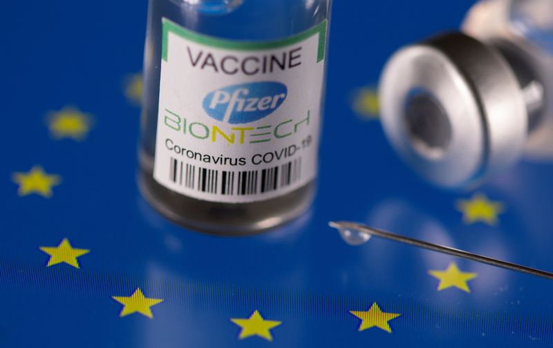 Vials labelled “Pfizer BioNtech coronavirus disease (COVID-19) vaccine” placed on