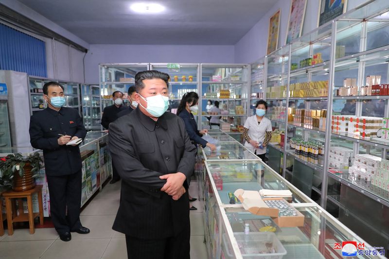 North Korean leader Kim Jong Un wears a face mask