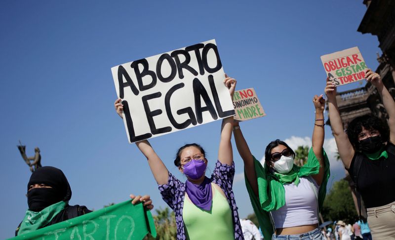 FILE PHOTO: Pro-abortion activists hold up banners during a protest