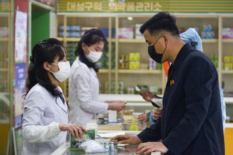 FILE PHOTO: A man visits a pharmacy, amid growing fears