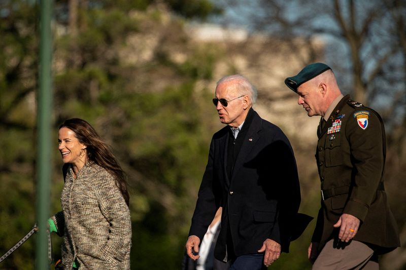 FILE PHOTO: U.S. President Joe Biden walks towards his motorcade