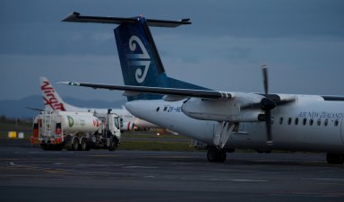 FILE PHOTO: An Air New Zealand aircraft passes a fuel