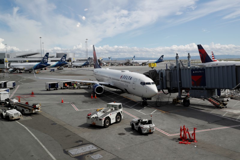 Planes are seen parked at gates at San Francisco International