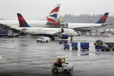 FILE PHOTO: Delta Airlines planes and a British Airways plane