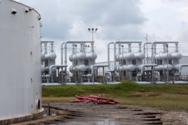 FILE PHOTO: An oil storage tank and crude oil pipeline