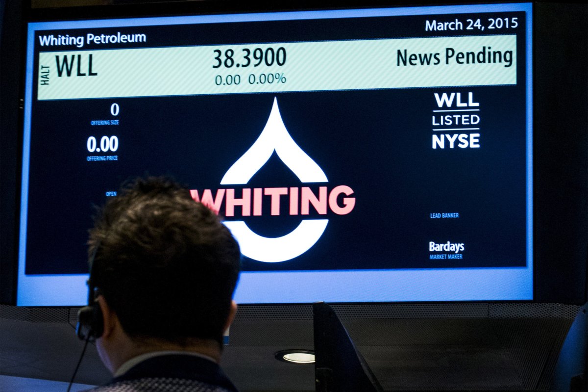 A trader waits for the opening of Whiting Petroleum’s stock