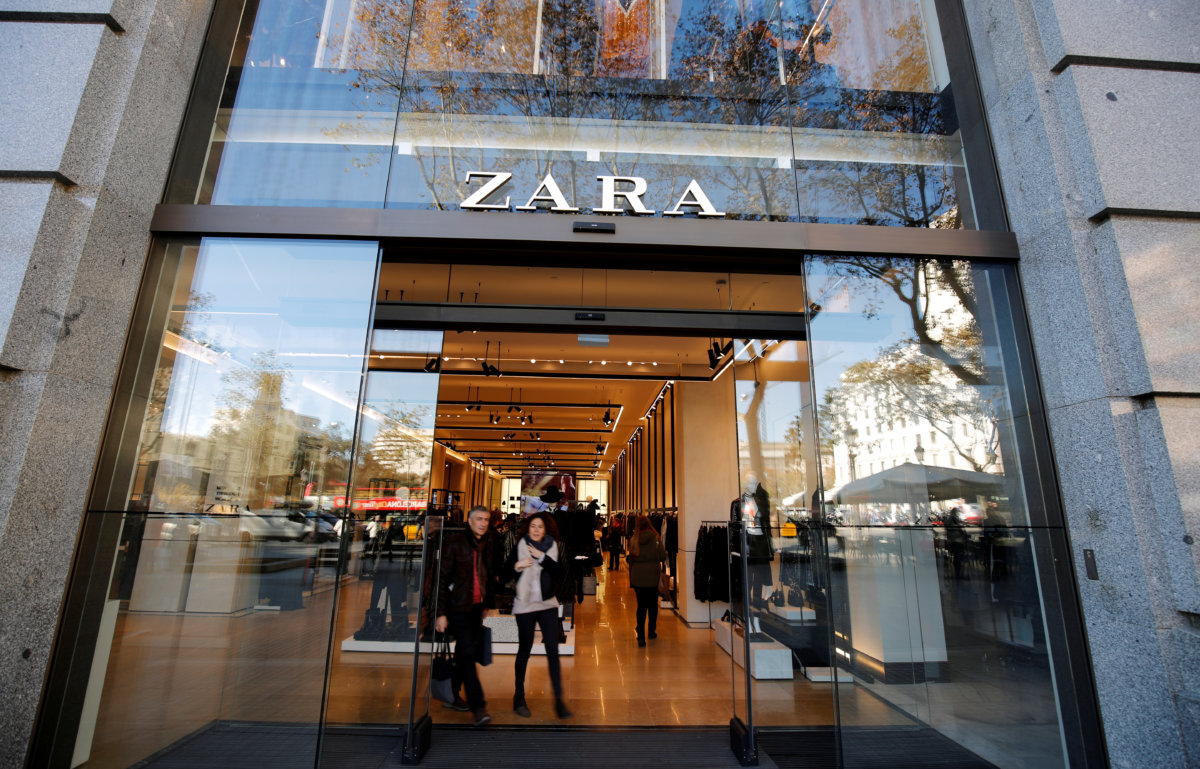 FILE PHOTO: People leave a Zara store, an Inditex brand,