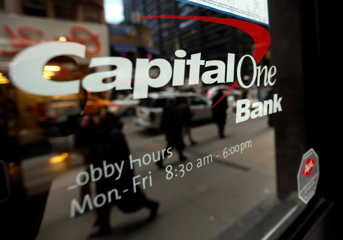 FILE PHOTO: People walk past a Capital One banking center