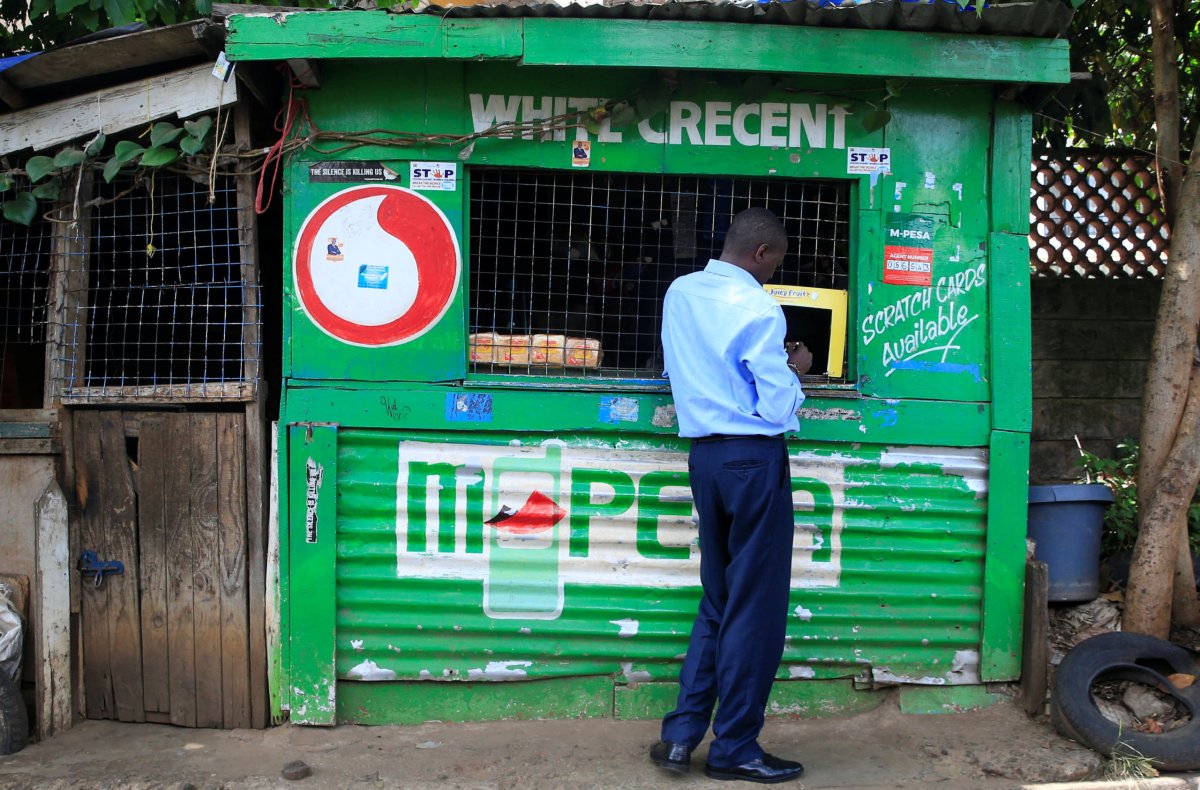 Customer conducts a mobile money transfer at a Safaricom agent
