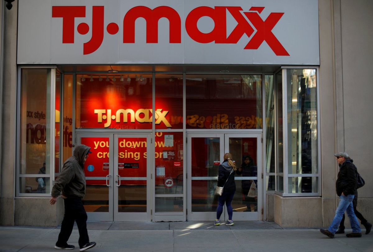 Pedestrians walk past a T.J. Maxx store in Boston