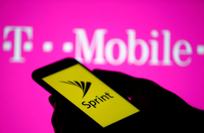 A smartphone with Sprint logo are seen in front of