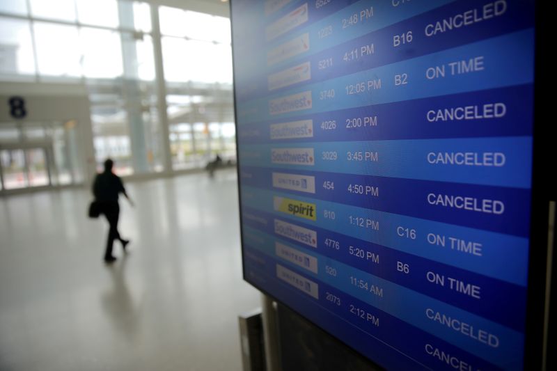 FILE PHOTO: Canceled flights are seen on an airport screen