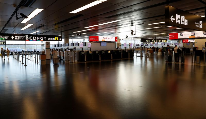 Empty check-in counters are seen at Vienna’s airport in Schwechat