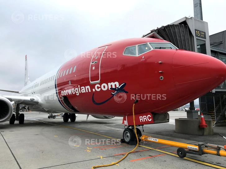 FILE PHOTO: A Norwegian Air plane is refuelled at Oslo