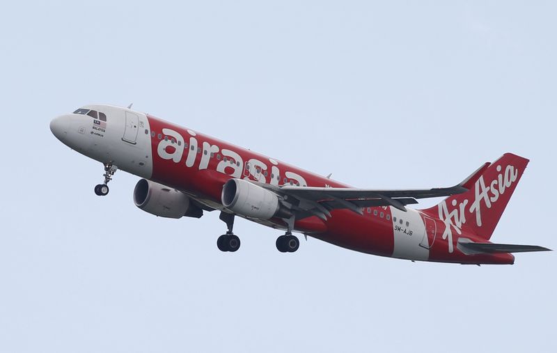 FILE PHOTO: An AirAsia Airbus A320 plane approaches Singapore’s Changi