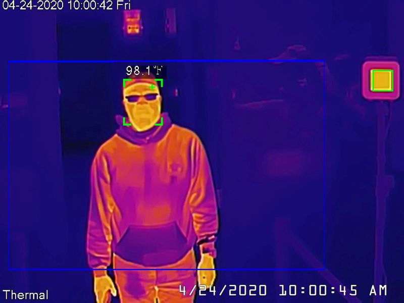 Dahua thermal camera takes a man’s temperature during a demonstration
