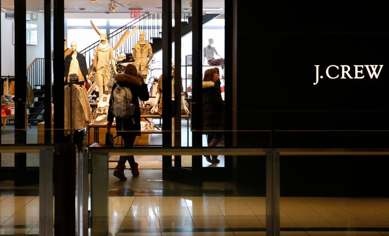 A customer walks into a clothing retailer J.Crew store in