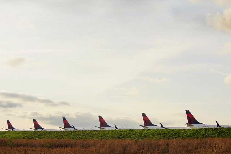 FILE PHOTO: Delta Air Lines passenger planes crowd a runway