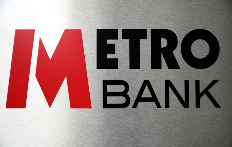 Signage is seen outside of a Metro Bank in London