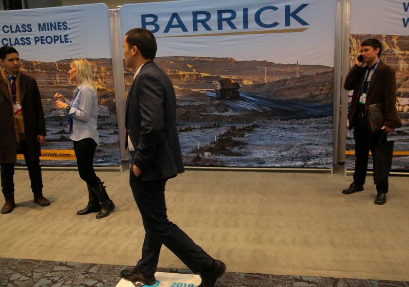 FILE PHOTO: A visitor passes a Barrick Gold mining company