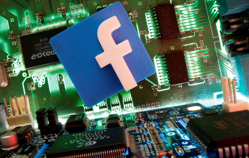 FILE PHOTO: Facebook symbol is seen on a motherboard in