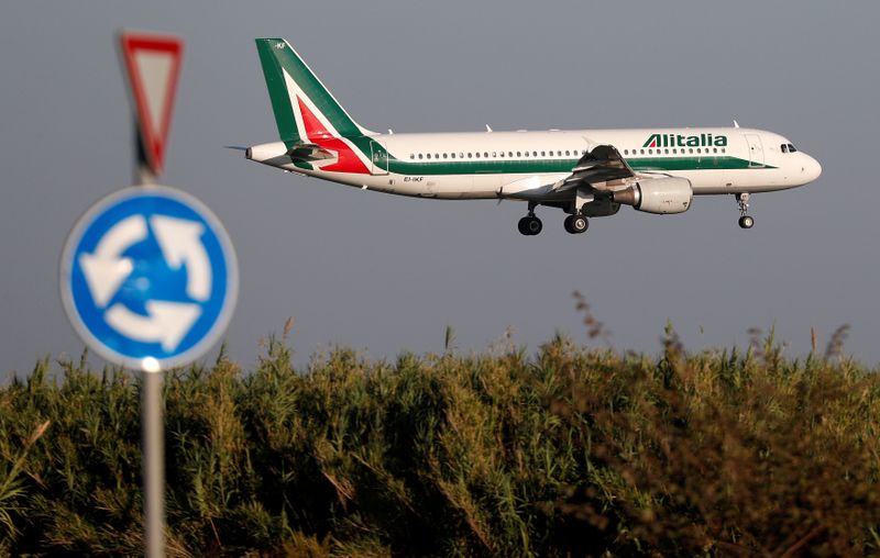 FILE PHOTO: An Alitalia Airbus A320 airplane approaches to land