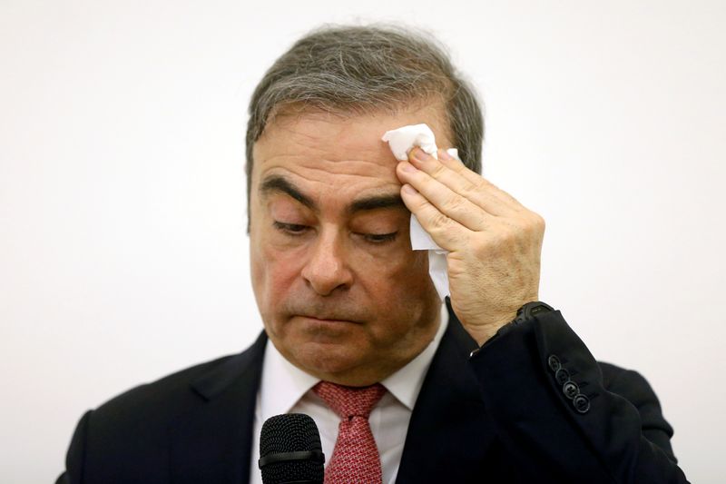 FILE PHOTO: Former Nissan chairman Carlos Ghosn attends a news