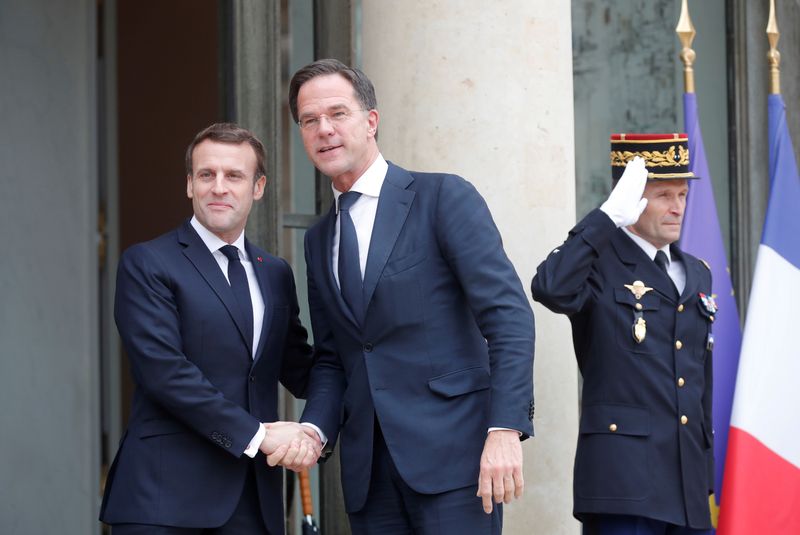 FILE PHOTO: French President Emmanuel Macron welcomes Dutch Prime Minister