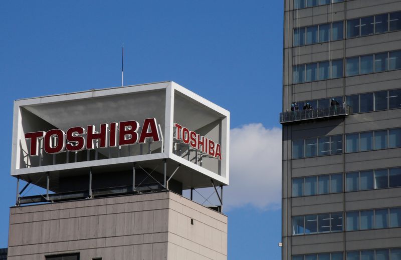 The logo of Toshiba Corp is seen as Window cleaners
