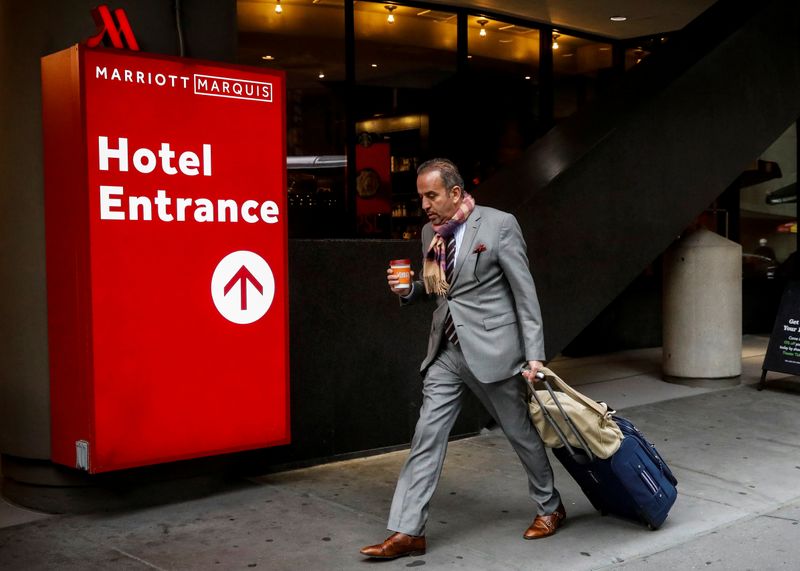A guest arrives at the Marriott Marquis hotel in Times