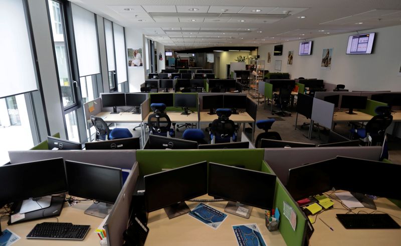 Open office workspace is seen in an empty office in
