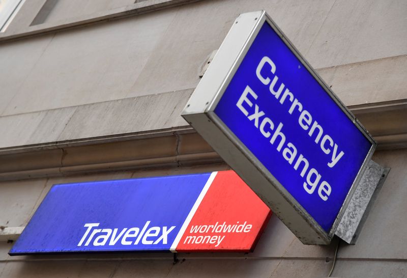 Signage is seen on a branch of Travelex Currency Exchange