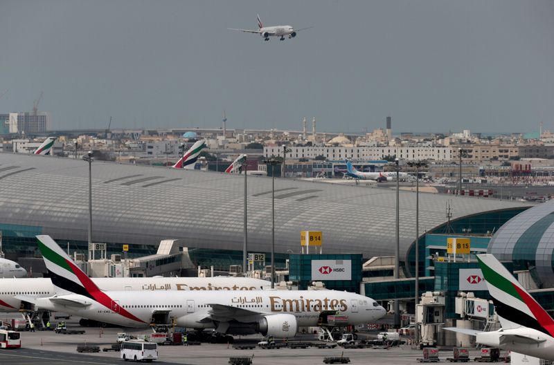 Emirates Airline plane lands at the Dubai International Airport in