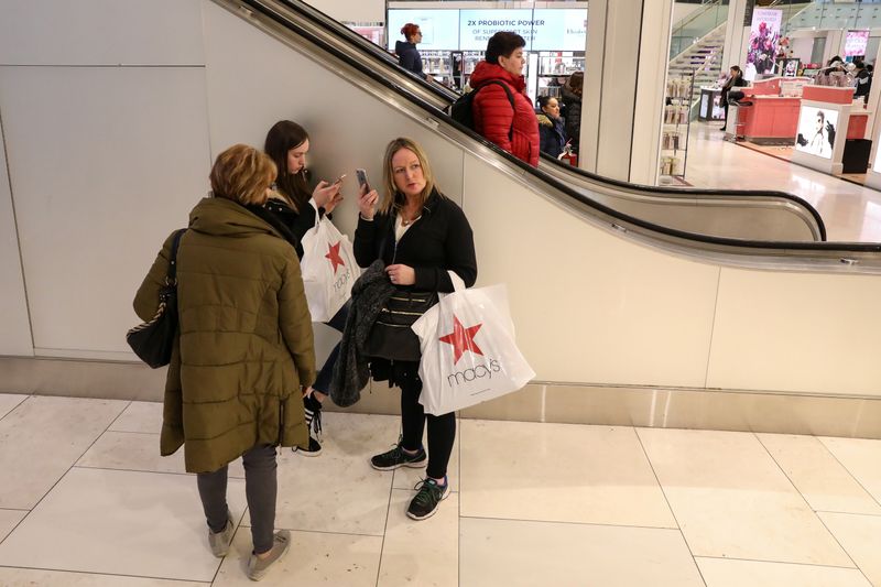 People shop at Macy’s Department store in New York