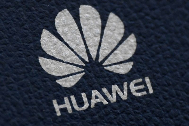 The Huawei logo is seen on a communications device in