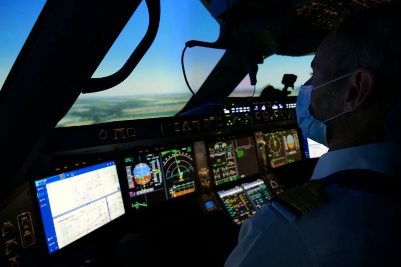 An Air France pilot trains in a flight simulator at