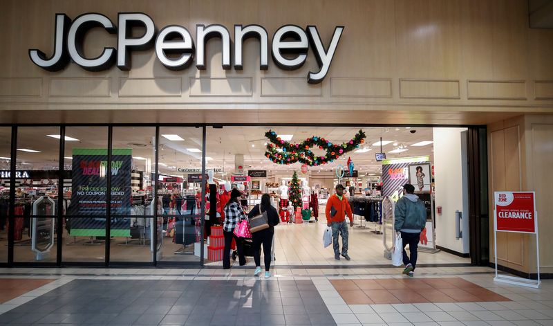 FILE PHOTO: Shoppers enter and leave the J.C. Penney department
