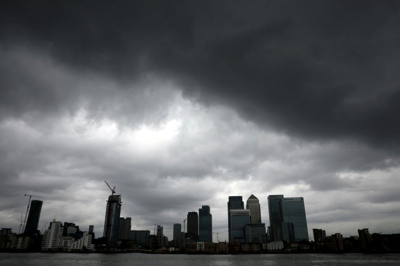 Rain clouds pass over the Canary Wharf financial district in